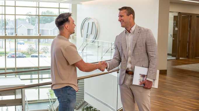 Mortgage Banker shaking hands with Customer
